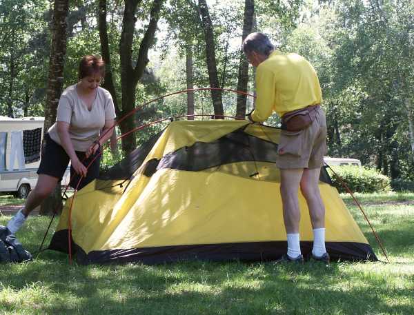 Putting up a tent on one of our cycling holidays